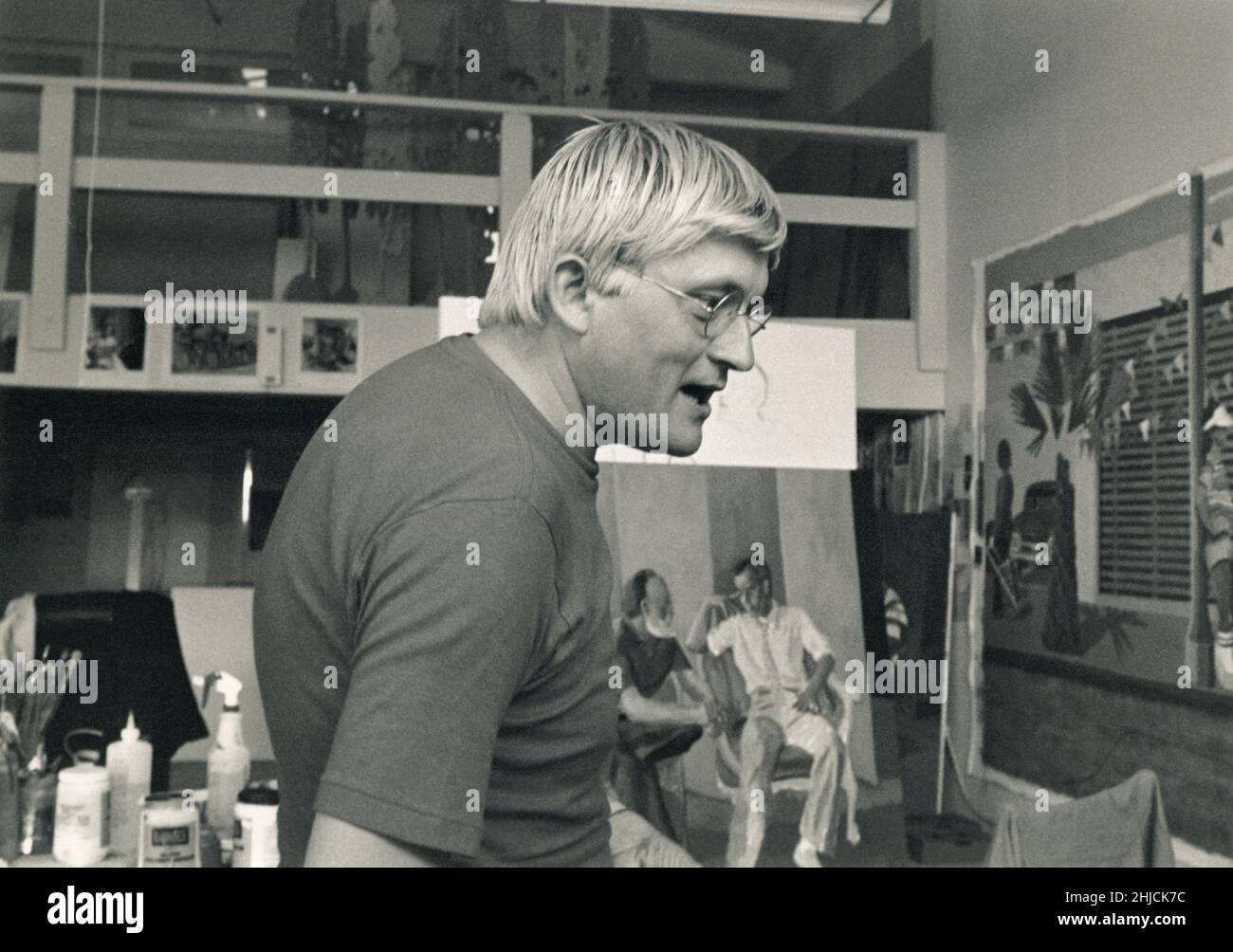 David Hockney in his Pico Boulevard studio in Los Angeles, 1979. Hockney was a major contributor to the British Pop art movement of the 1960's, and lives today in Los Angeles, California. Stock Photo