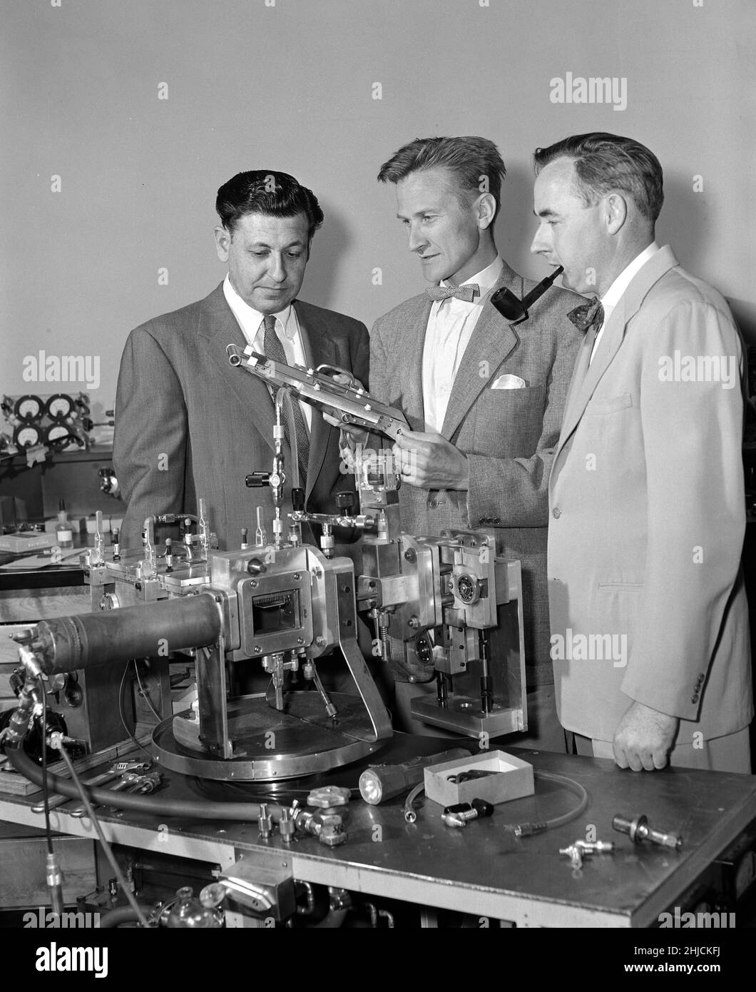 The co-discoverers of nobelium (element 102) in the HILAC building, Lawrence Berkeley Laboratory (LBL) in 1958 with Albert Ghiorso, Torbjorn Sikkeland, and John R. Walton, (Glenn T. Seaborg absent.) The discovery of element 102 was a complicated process and was claimed by groups from Sweden, the United States, and the former Soviet Union. The first complete and incontrovertible report of its detection only came in 1966 from the Joint Institute of Nuclear Research at Dubna (then in the Soviet Union). Stock Photo