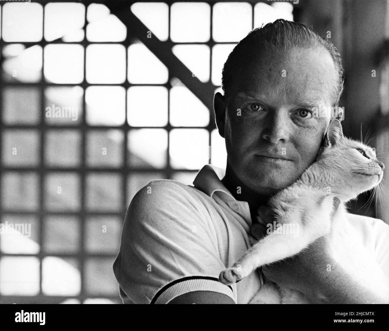 The writer Truman Capote and his cat in 1963. Truman Capote (September 30,  1924 ‚Äì August 25, 1984) was an American writer best known for his true  crime book, In Cold Blood