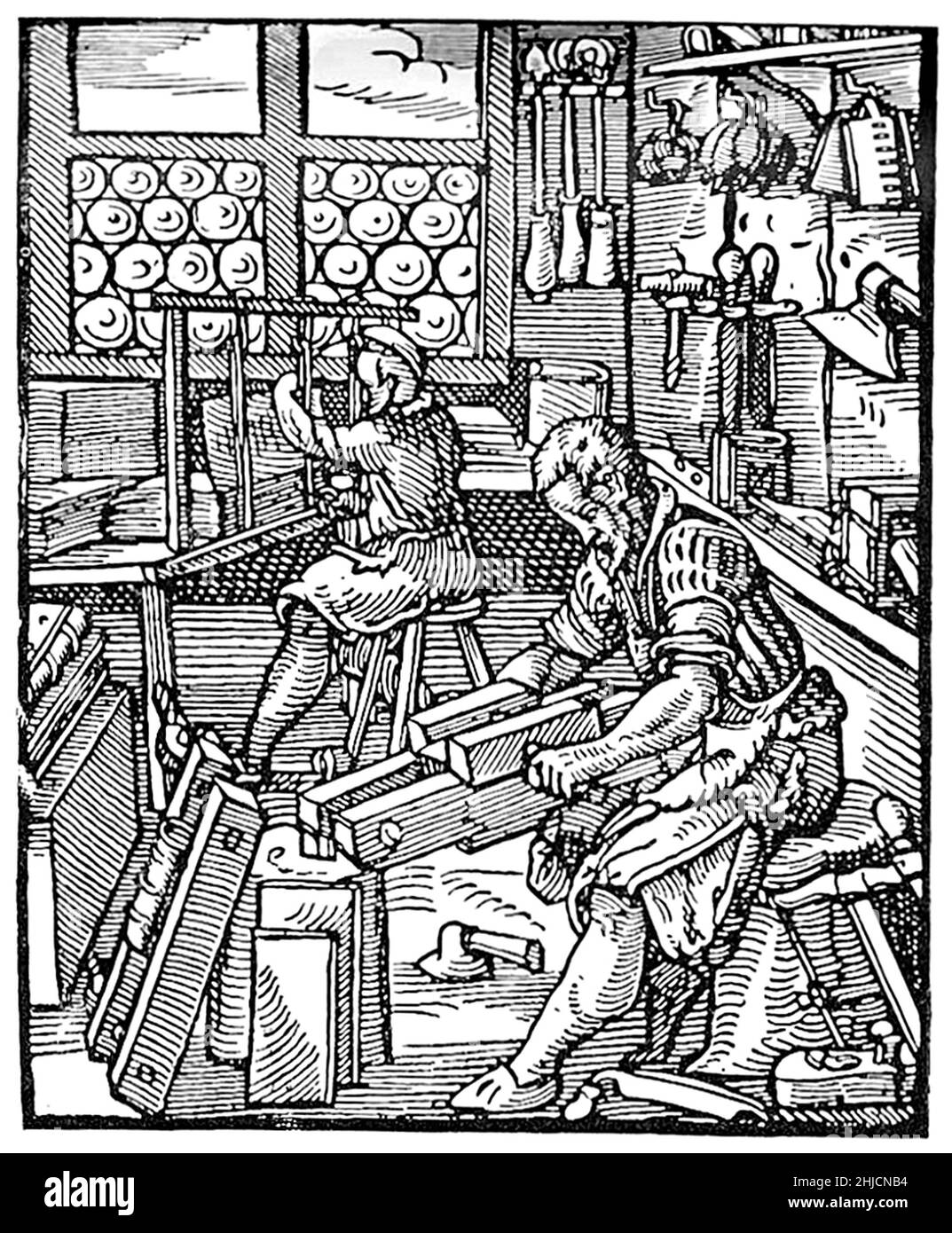 Medieval bookbinders at work. Illustration from Jost Amman's Book of Trades, 1568. Stock Photo