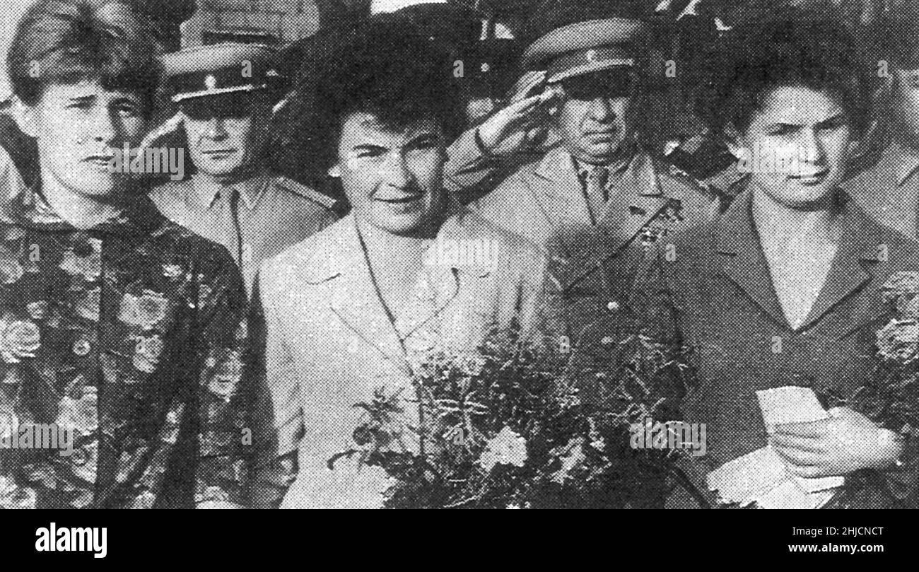 Here are three women cosmonauts at Tyura-Tam prior to the launch of Vostok 6 on June 16, 1963. Left to right are Valentina Ponomareva, backup Irina Solovyeva, and prime crewmember Valentina Tereshkova. Behind the women are State Commission Chairman Georgiy Tyulin (left) and Strategic Missile Forces Commander-in-Chief Sergey Biryuzov. Tereshkova was the first woman in space, spending 3 days aboard Vostok 6. Stock Photo