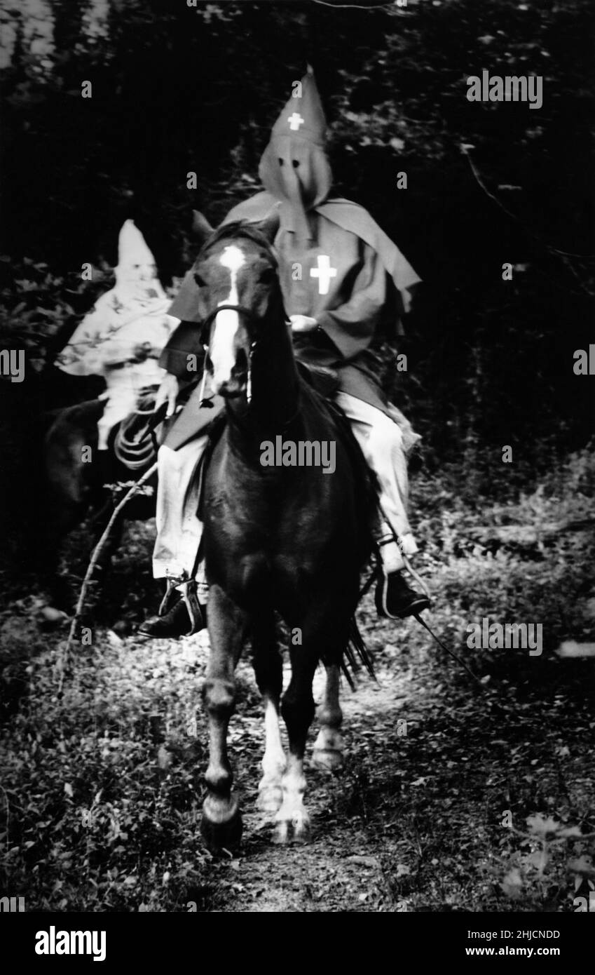 Two hooded Ku Klux Klansmen on horseback. Stock Photo