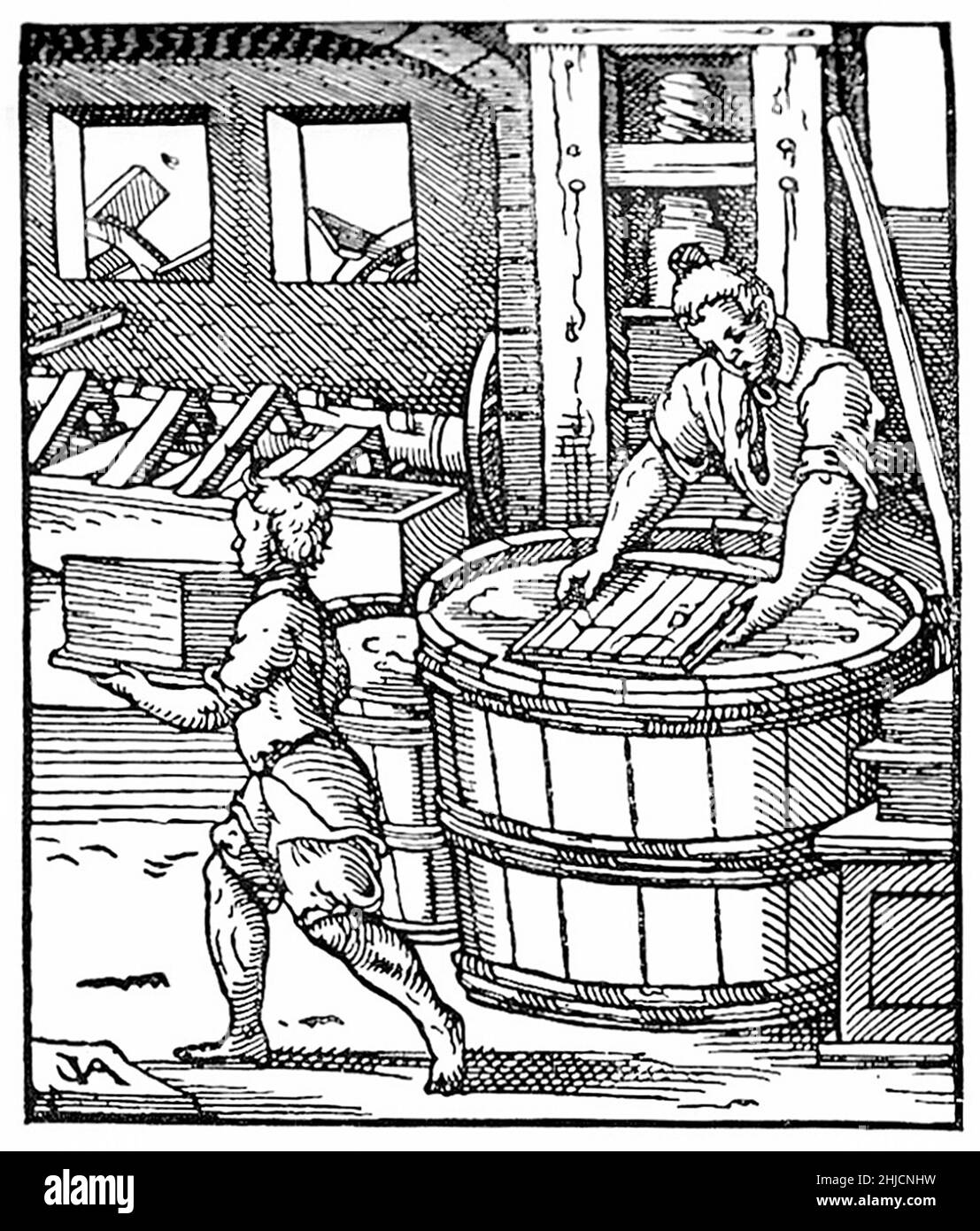 Medieval tradesmen making paper.  Water wheels (through windows) drive the pulping machinery (left, background) and the large press (right, background) used for pressing sheets of paper before drying. The man at right is arranging an even layer of pulp onto a frame ready for pressing and the boy is carrying away a stack of finished sheets. Illustration from Jost Amman's Book of Trades, 1568. Stock Photo