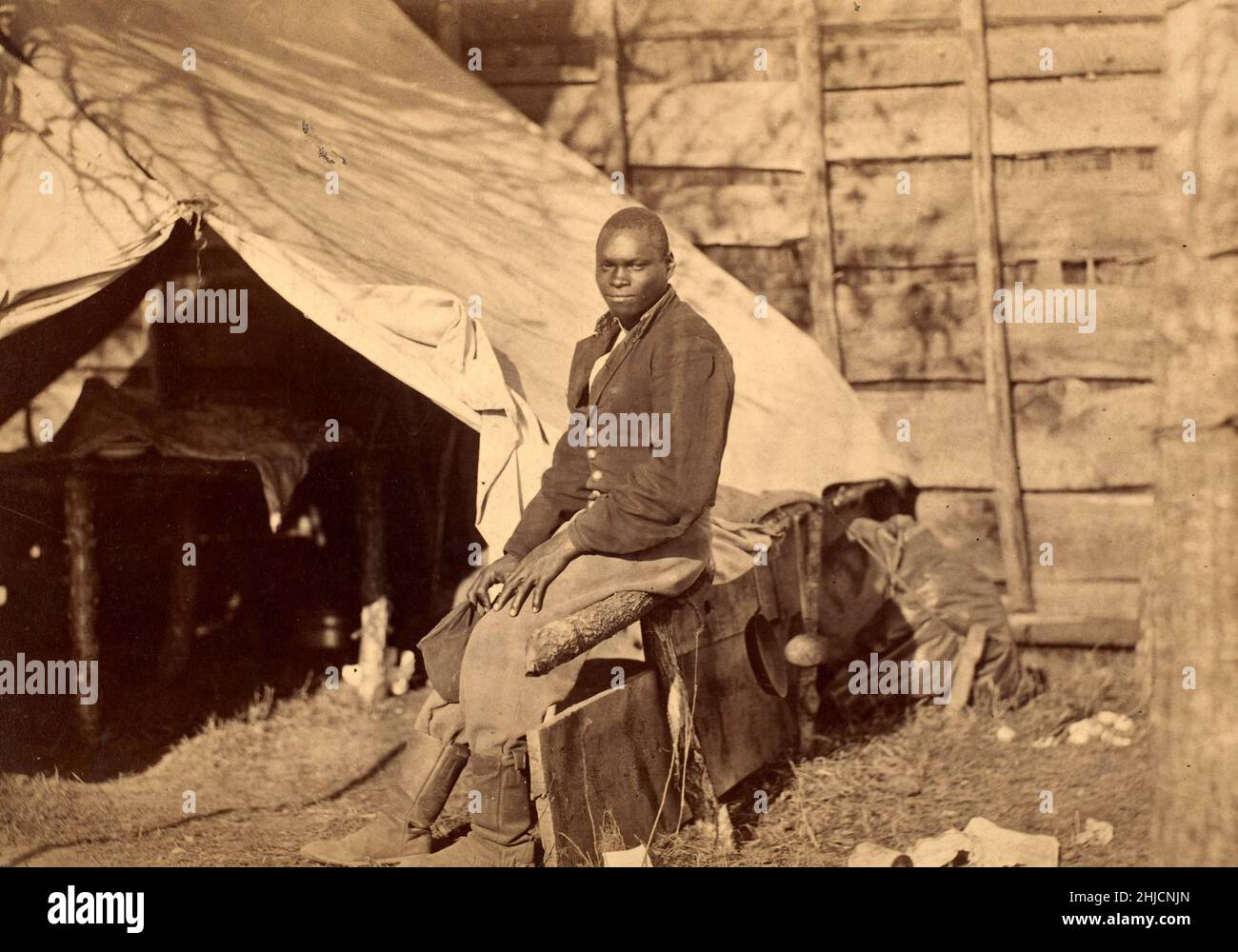 Black Soldier in Camp, American Civil War, circa 1863. Photo possibly by Alexander Gardner. Stock Photo