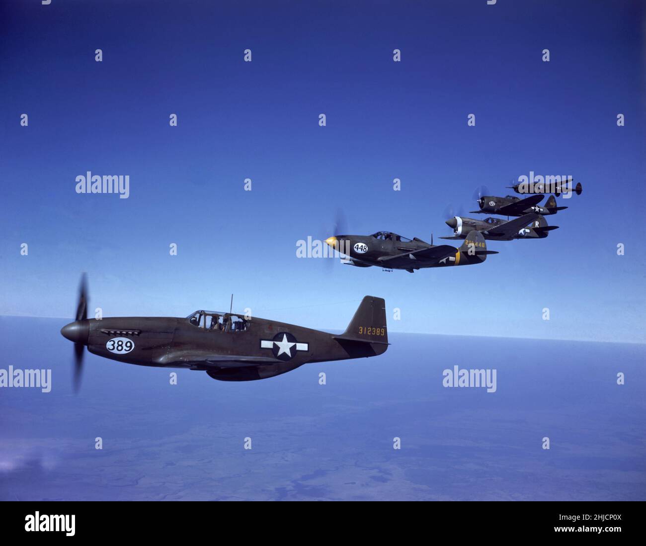 Warplanes flying in a straight line. Stock Photo
