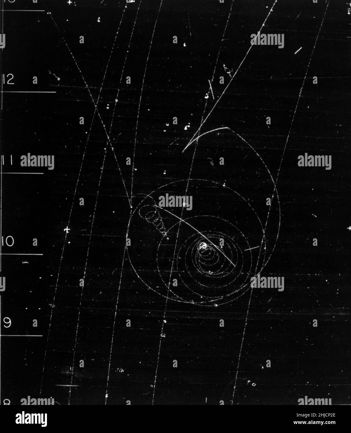 Bubble chamber event: a rare decay of a lambda into a negative muon, a proton, and a neutrino is photographed in the 72 inch Hydrogen Bubble Chamber, May 1962. A bubble chamber is a vessel filled with a superheated transparent liquid (most often liquid hydrogen) used to detect electrically charged particles moving through it. Stock Photo