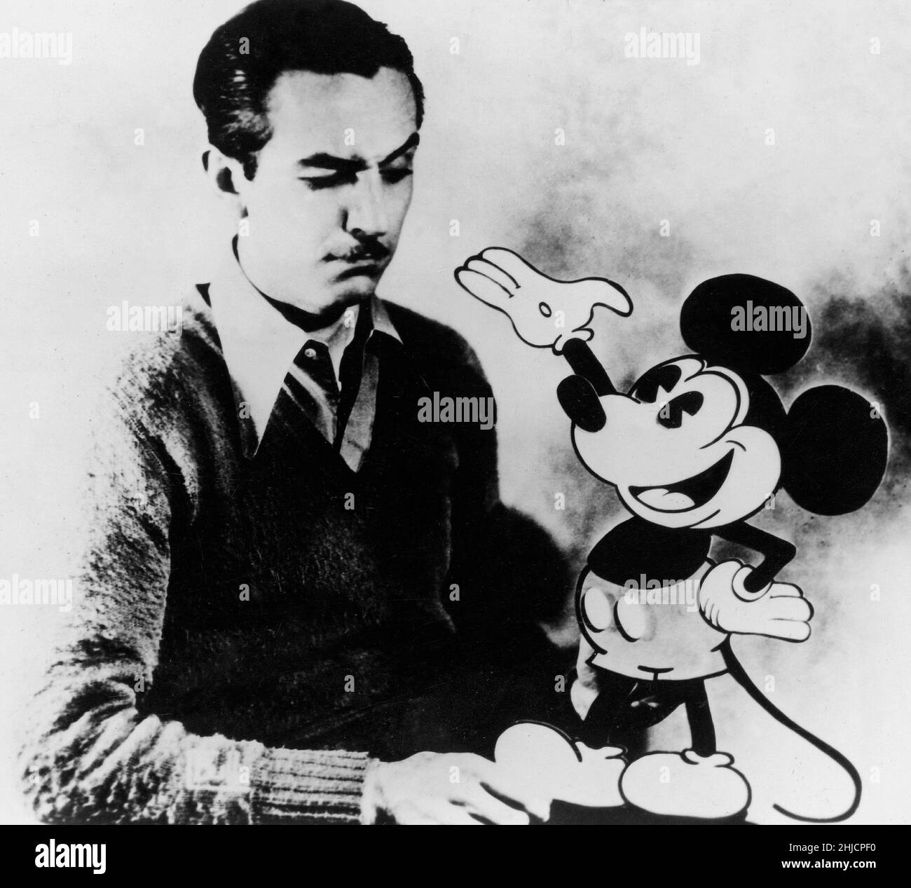 American animator Walt Disney (1901-1966) with the character of Mickey Mouse, whom he created in 1928. Stock Photo