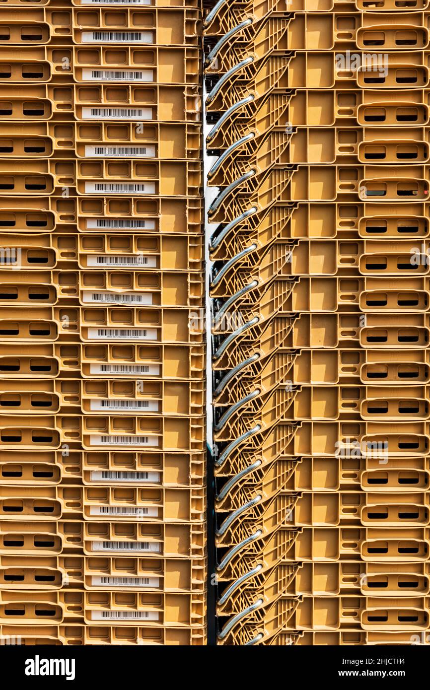 Vertically stacked plastic storage crates. Stock Photo