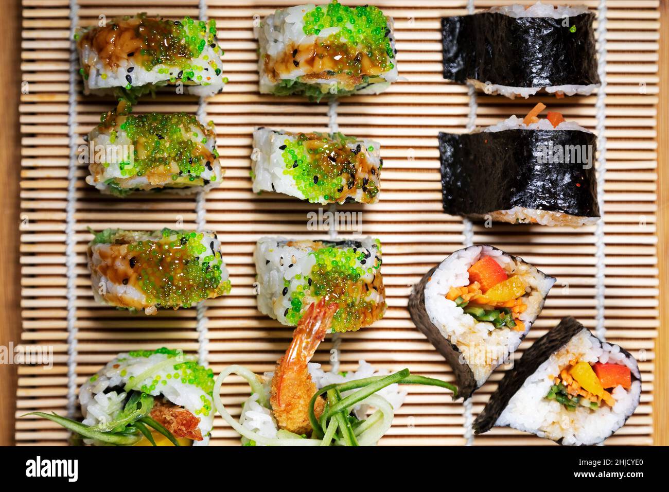 A platter of sushi featuring uramaki and maki. Stock Photo