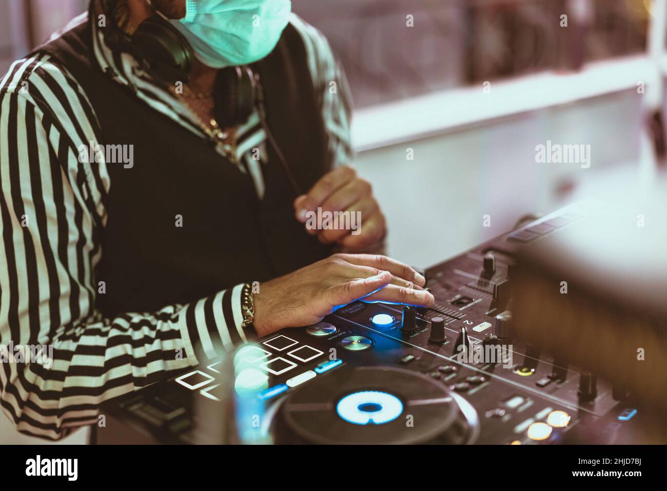 Dj mixing music wearing face mask during covid19 Party nightlife concept Stock Photo Alamy