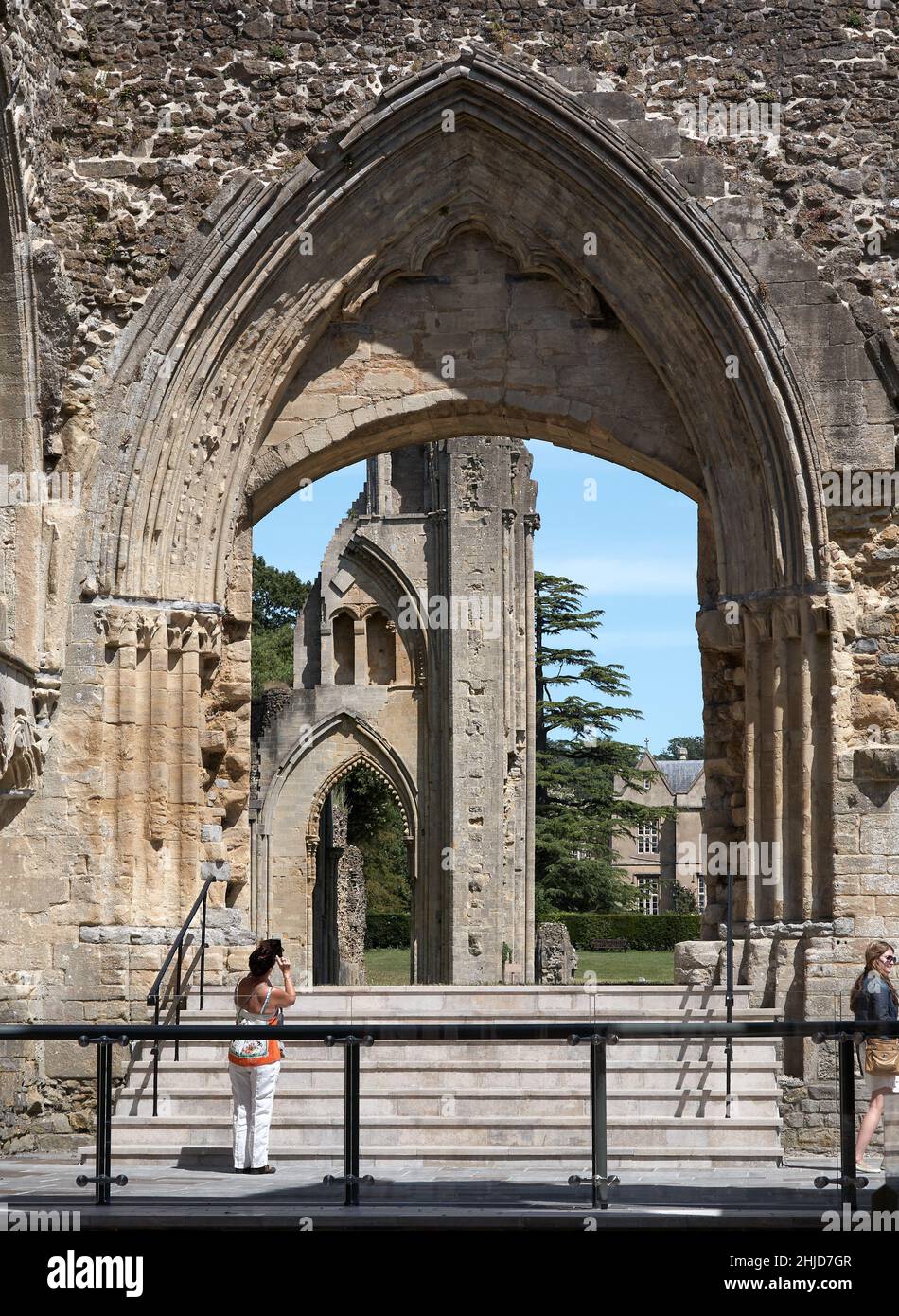 Visitors photographing  in the ruins of Glastonbury Abbey Stock Photo