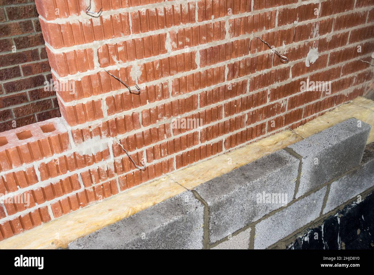 An insulated cavity wall under construction in a house extension, England, UK Stock Photo