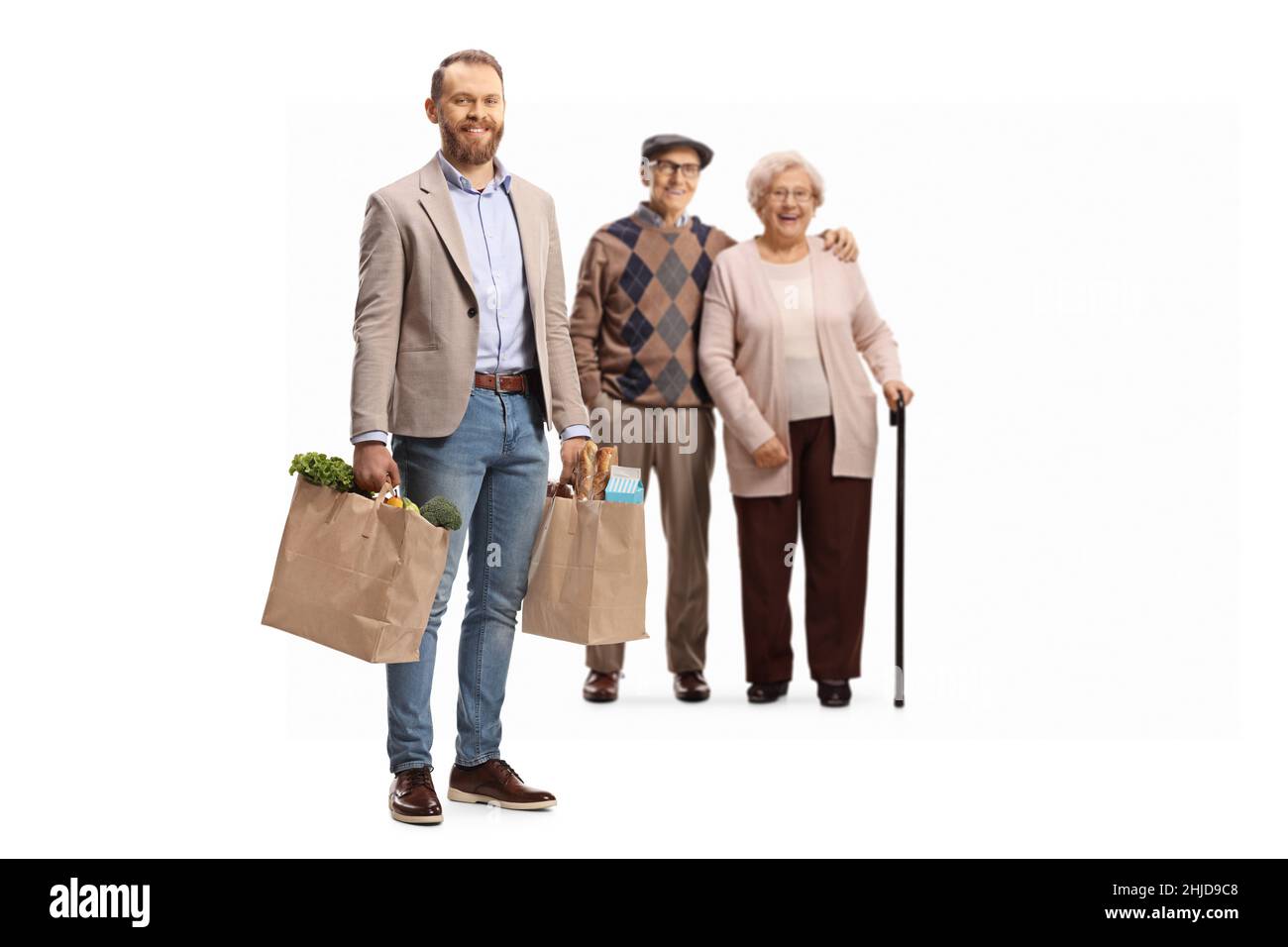 Male helping old woman bags hi-res stock photography and images - Alamy