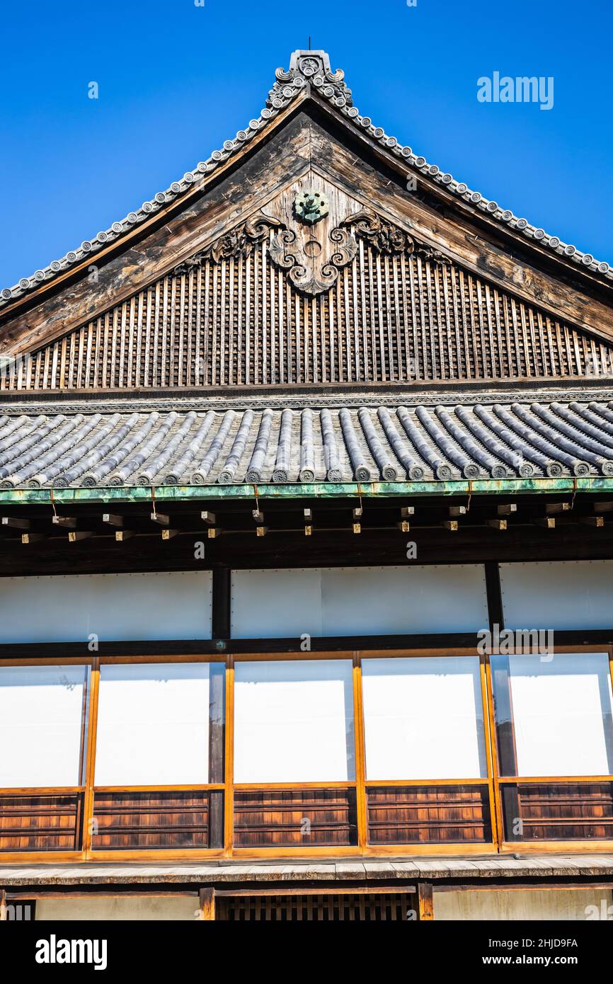 A detail of the architecture of Nijo Castle in Kyoto Japan with a blue sky and direct sunlight. Stock Photo