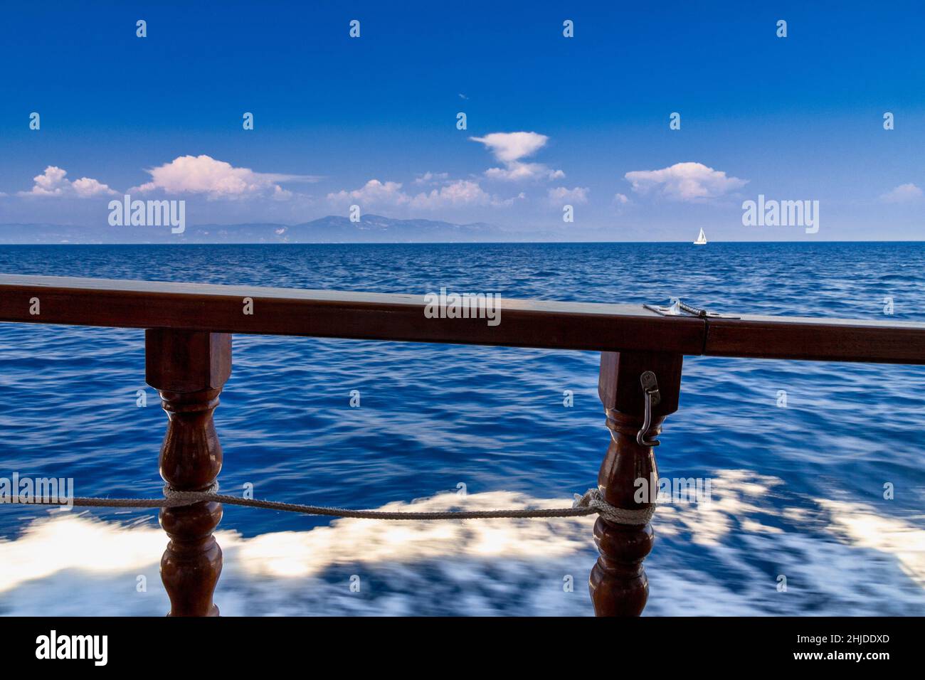View of the sea through the wooden railing of a cruise ship Stock Photo ...