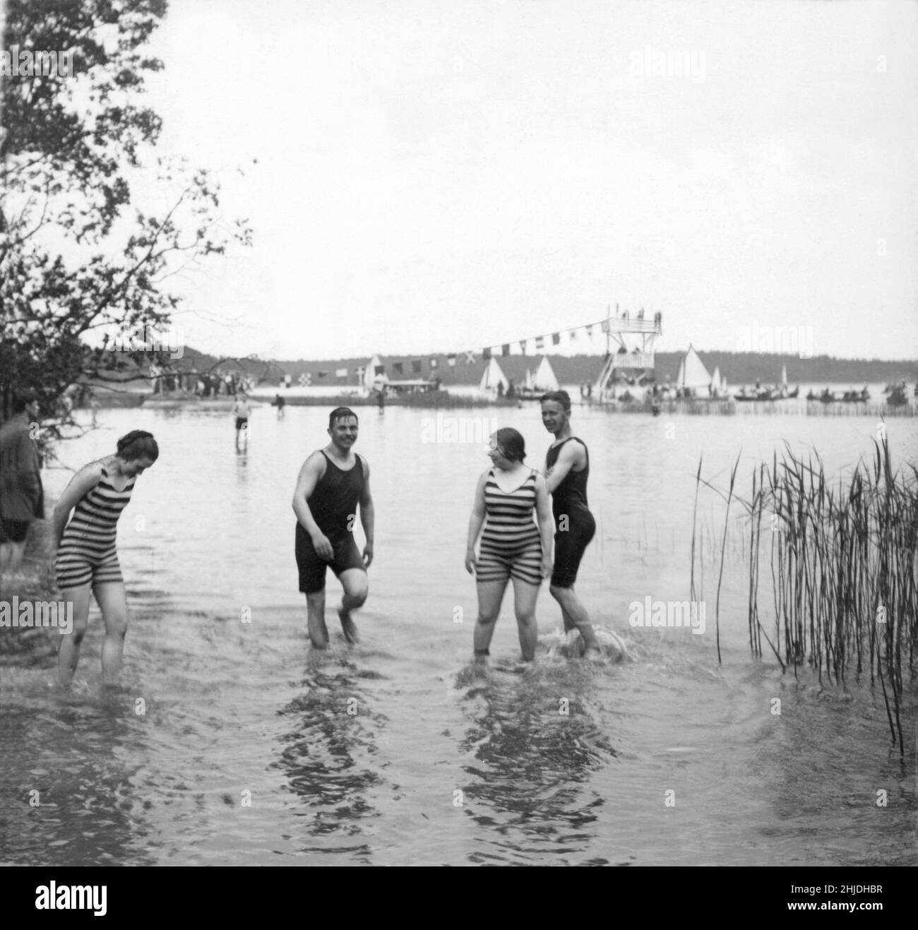 First bath where men and women are allowed to take a bath together june 15 1913. Close to Hässelby in Stockholm. Many thought this was immoral and upsetting despite the bathing clothes both women and men wore are covering most of their bodies. One reporter wrote after the grand opening 'may god preserve us from any more places of the sort'. Stock Photo