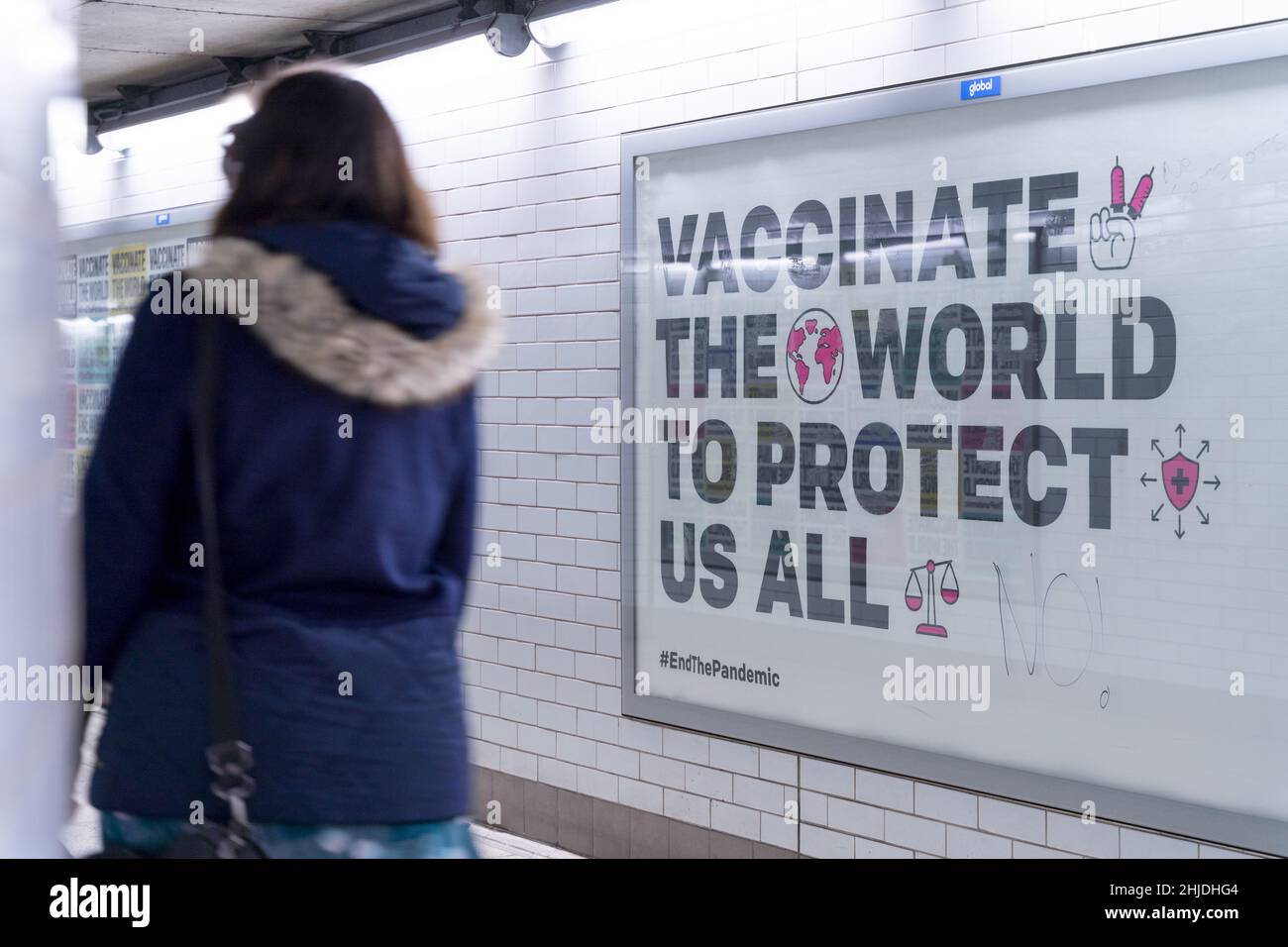 huge poster on the billboard showing 'vaccine the world to protect us all', London England UK self Isolation rules  covid restriction ending early Stock Photo
