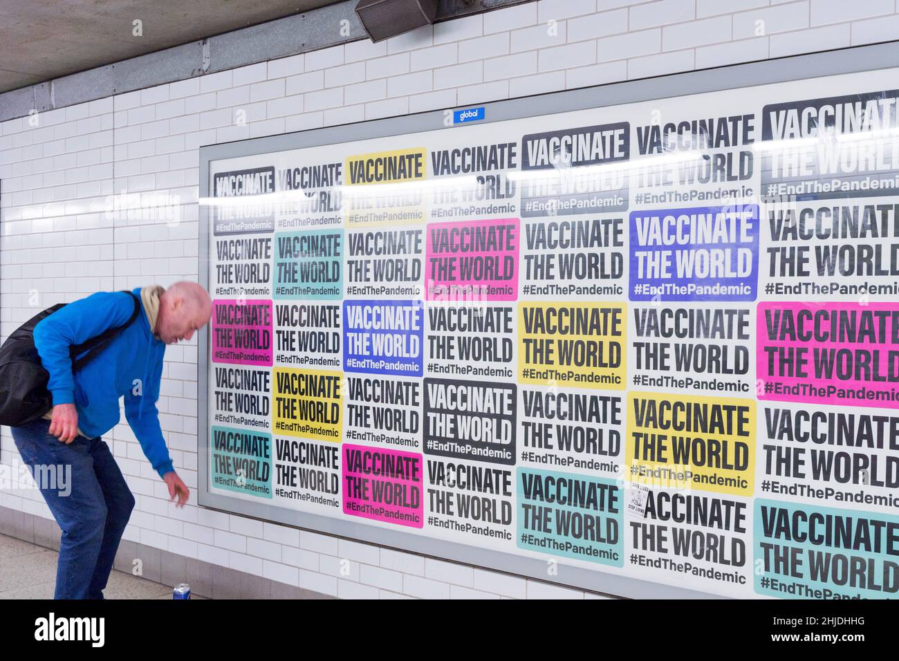 huge poster on the billboard showing a collections of multiple messages 'Vaccinate the world', London England UK Stock Photo