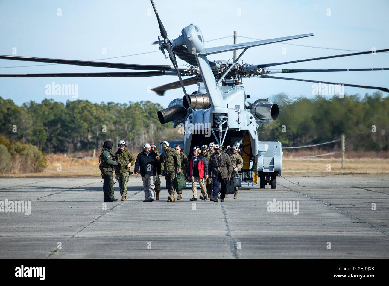 Secretary of the Navy Carlos Del Toro exits a CH-53K Super Stallion at Marine Corps Auxiliary Landing Field (MCALF) Bogue, North Carolina, Jan. 27, 2022. While at MCALF Bogue, Del Toro met with II Marine Expeditionary Force leadership and observed an Expeditionary Advanced Based Operations demonstration in an effort to become acquainted with II MEF capabilities. (U.S. Marine Corps photo by Lance Cpl. Jacob Bertram) Stock Photo