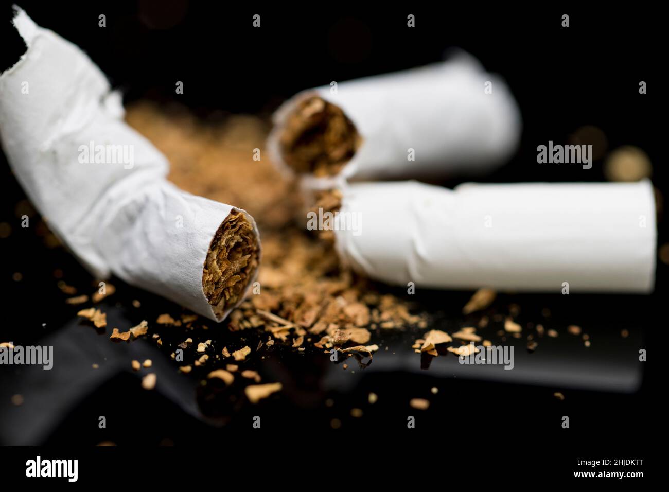 Broken cigarette close up quitting smoking. Breaking bad habits Stock