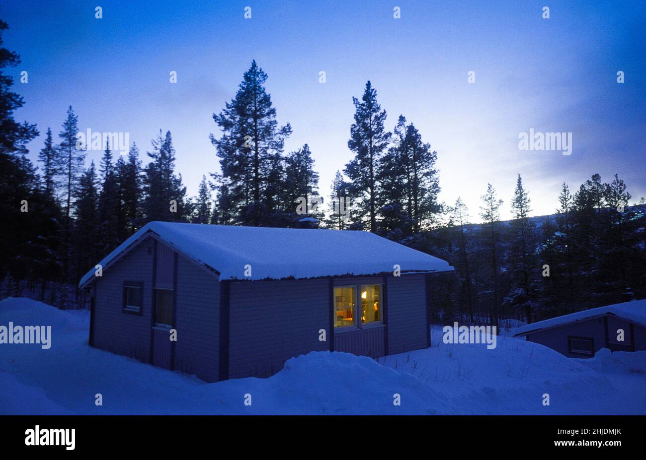 Winter cottage in twilight Stock Photo Alamy