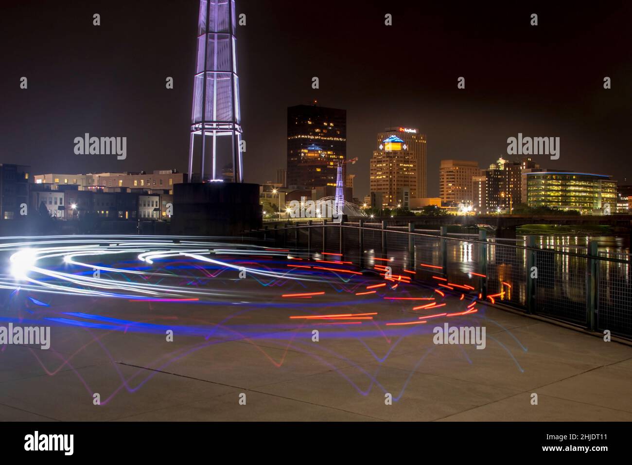 Bicycle light trails. City of Dayton in the background. Deeds Point Metropark, Dayton, Ohio, USA. Stock Photo