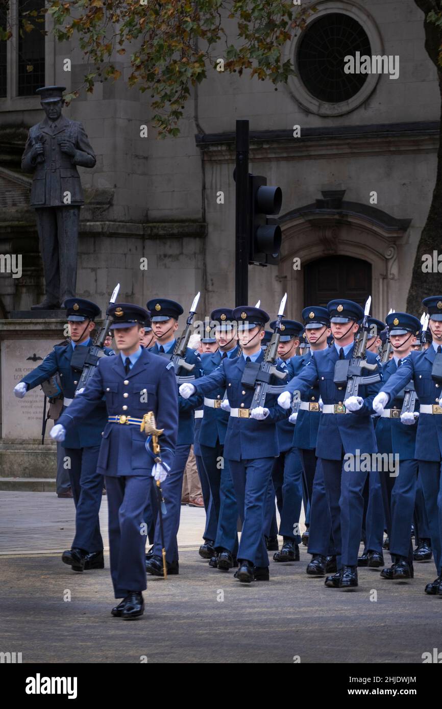The Queen’s Colour Squadron of the Royal Air Force (RAF) outside the RAF central church - St. Clement Danes. Statue of Arthur 'Bomber' Harris, London Stock Photo