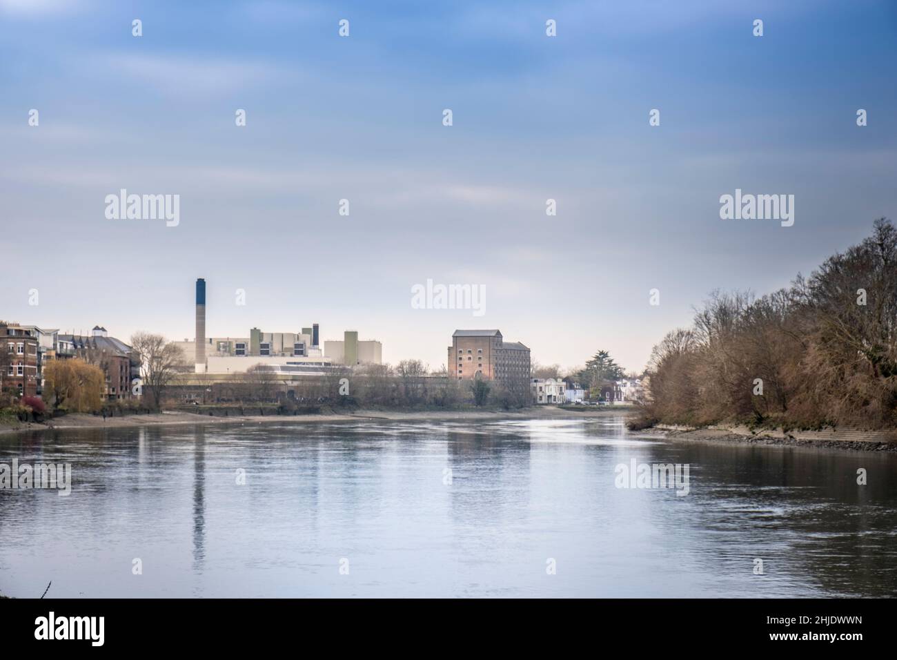 River Thames at Mortlake, London. Chimneys & buildings of The Stag Brewery redevelopment site (formerly the Watneys & the Anheuser Busch brewery). Stock Photo