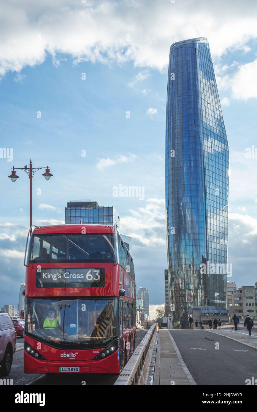 Red London Number 63 bus in traffic on Blackfriars bridge. Empty cycle lanes & the One Blackfriars building (aka the Vase / Mummy / Boomerang) behind. Stock Photo