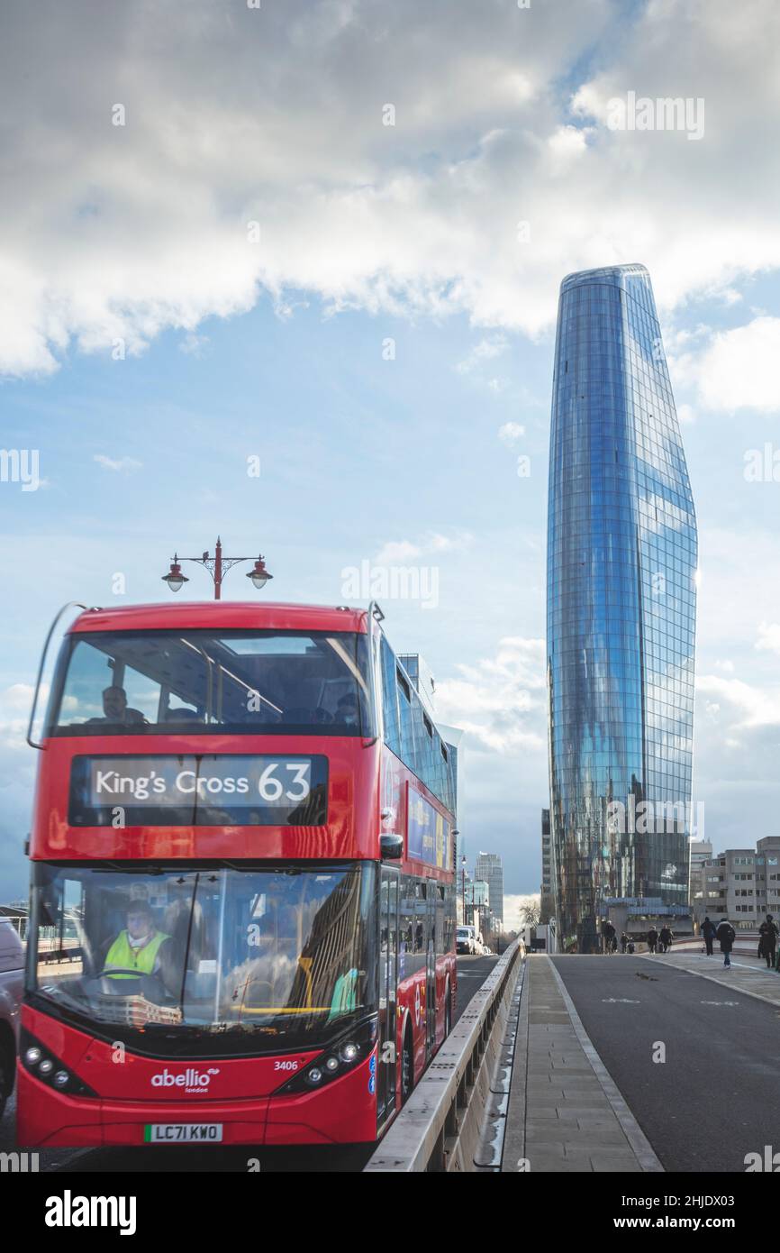 Red London Number 63 bus in traffic on Blackfriars bridge. Empty cycle lanes & the One Blackfriars building (aka the Vase / Mummy / Boomerang) behind. Stock Photo
