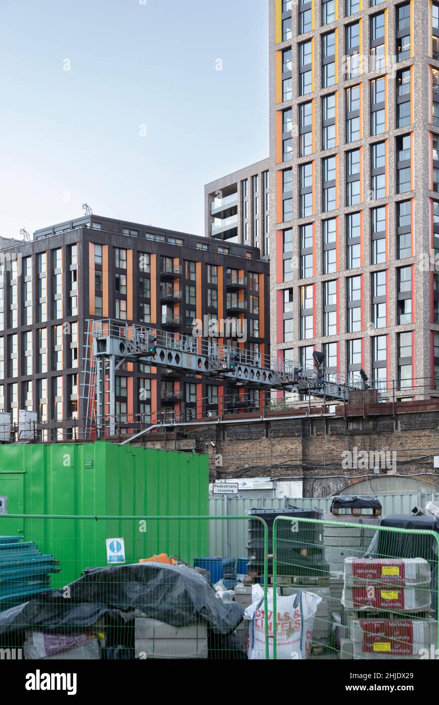 A builder's yard, railway bridge and commercial and residential real estate around the Bellway building, Vauxhall, Borough of Wandsworth, London SW11 Stock Photo