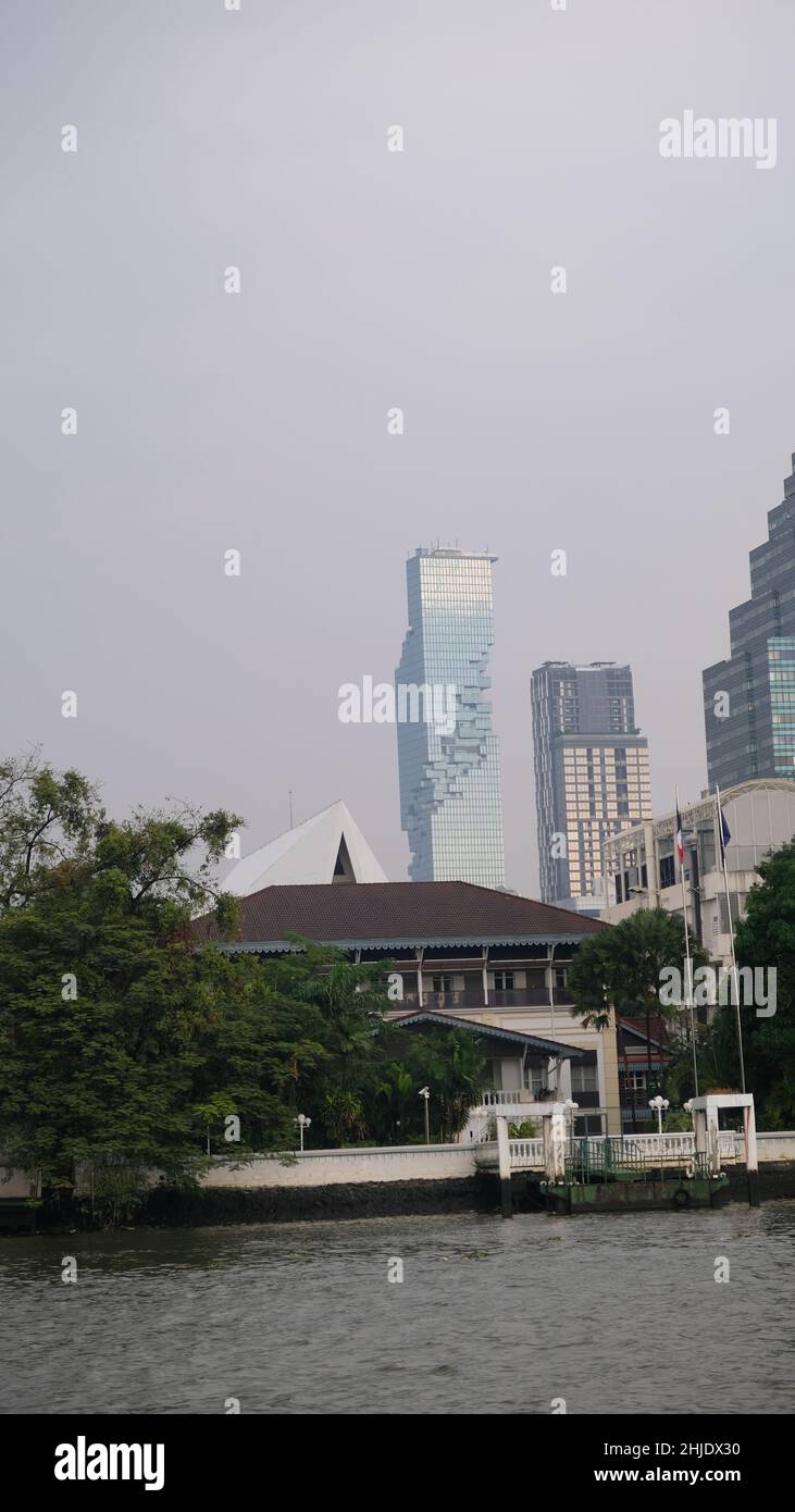 The Danish East Asiatic Trading Company’s building is upfront with the King Power Mahanakhon Building in the far background view from the Chao Phraya Stock Photo