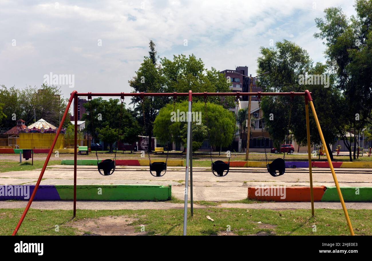 swings for children in a park without people Stock Photo