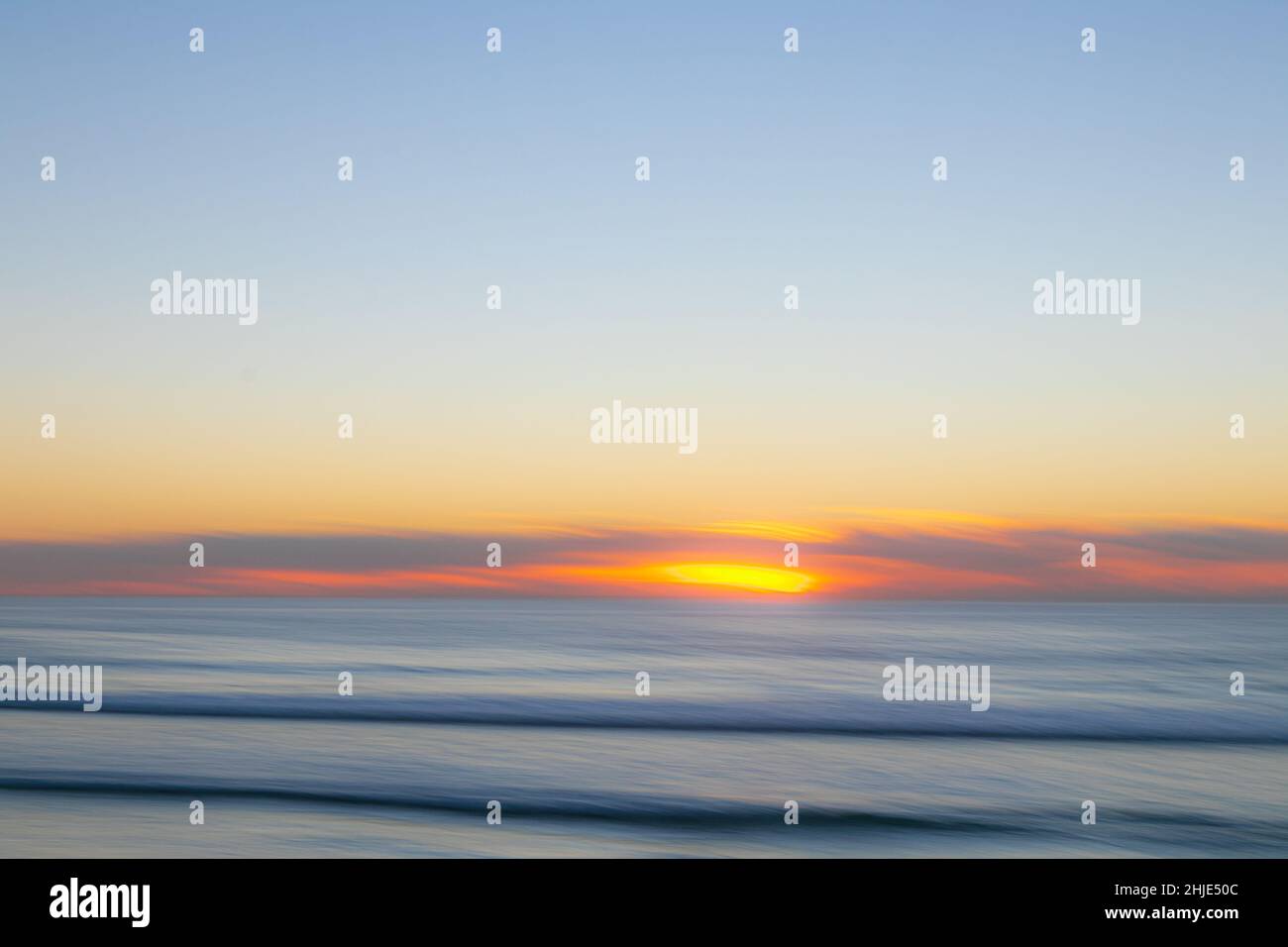 Torrey Pines State Beach La Jolla, California, USA. 28th Jan 2022. January 28, 2022: The sunset at Torrey Pines State Beach La Jolla, California on Friday, January 28th, 2022. The sunset included people, cliffs, rocks, and a blimp. The state beach also had parking for the nearby Farmers Insurance Open golf tournament. (Credit Image: © Rishi DekaZUMA Press Wire) Credit: ZUMA Press, Inc./Alamy Live News Stock Photo