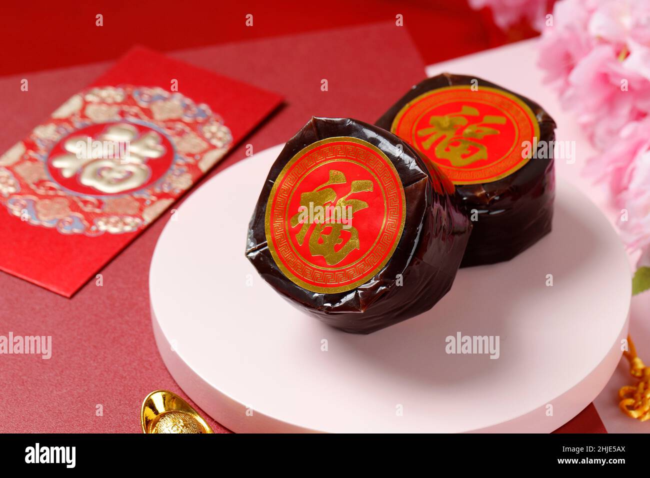 Chinese New Year Cake with Chinese character Fu means Fortune. Popular as Kue Keranjang or Dodol China in Indonesia. Imlek Red Concept Decoration Stock Photo