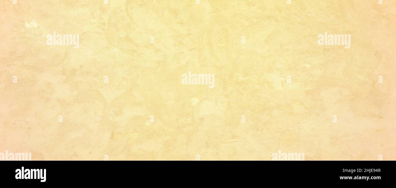 Rough grainy golden sand plastered wall texture background Stock Photo