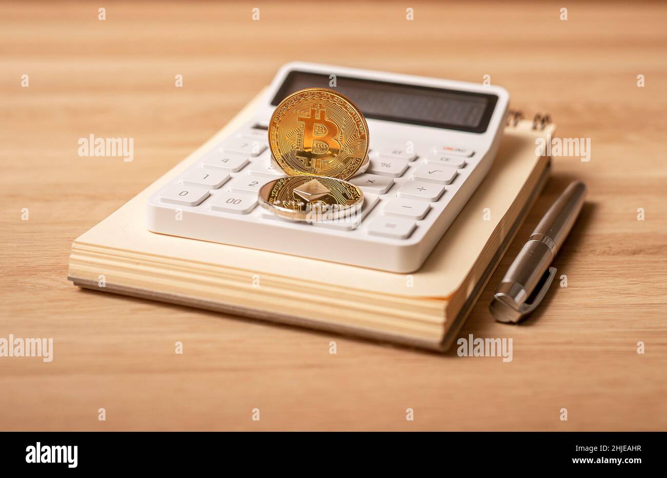 Bitcoin vs etherium in financial world. Cryptocurrency in bookkeeping.  Crypto investment and risks calculating Stock Photo - Alamy