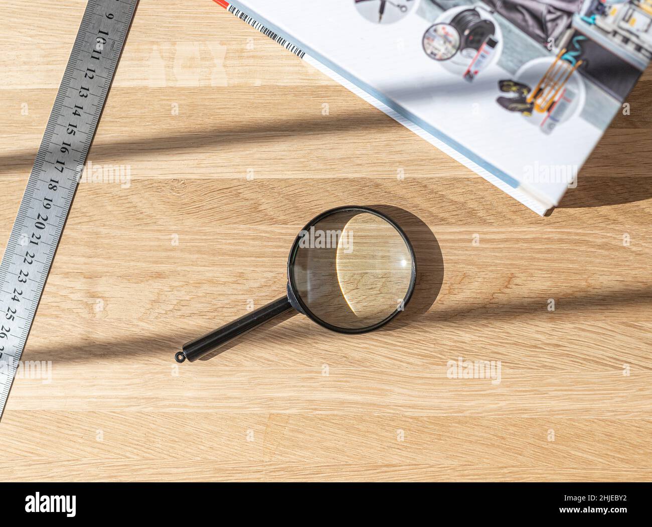 Magnifying Measure Ruler Technical flatlay with magnifying glass, ruler, tape measure and book ...