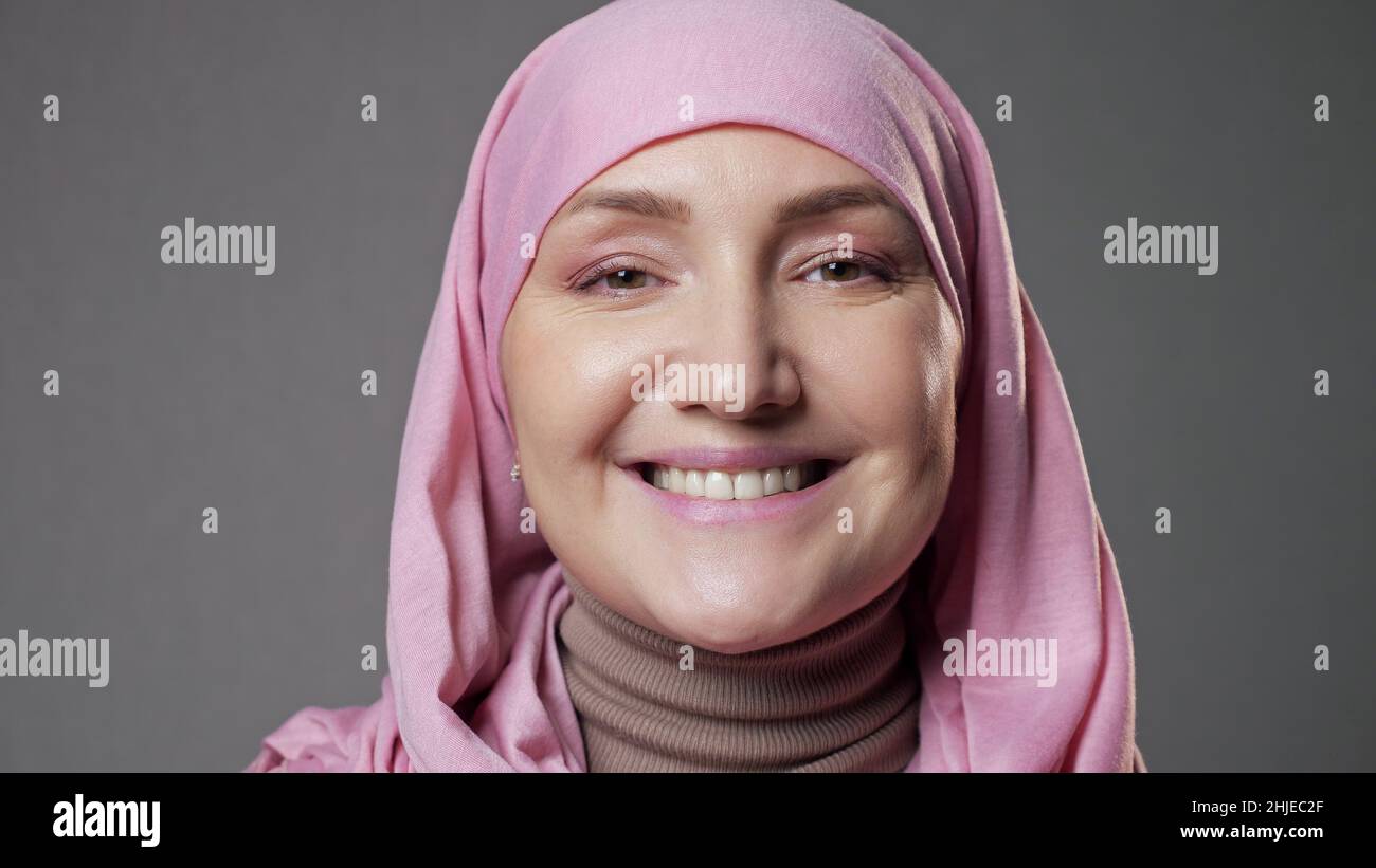 Young woman wearing pink hijab hi-res stock photography and images - Alamy
