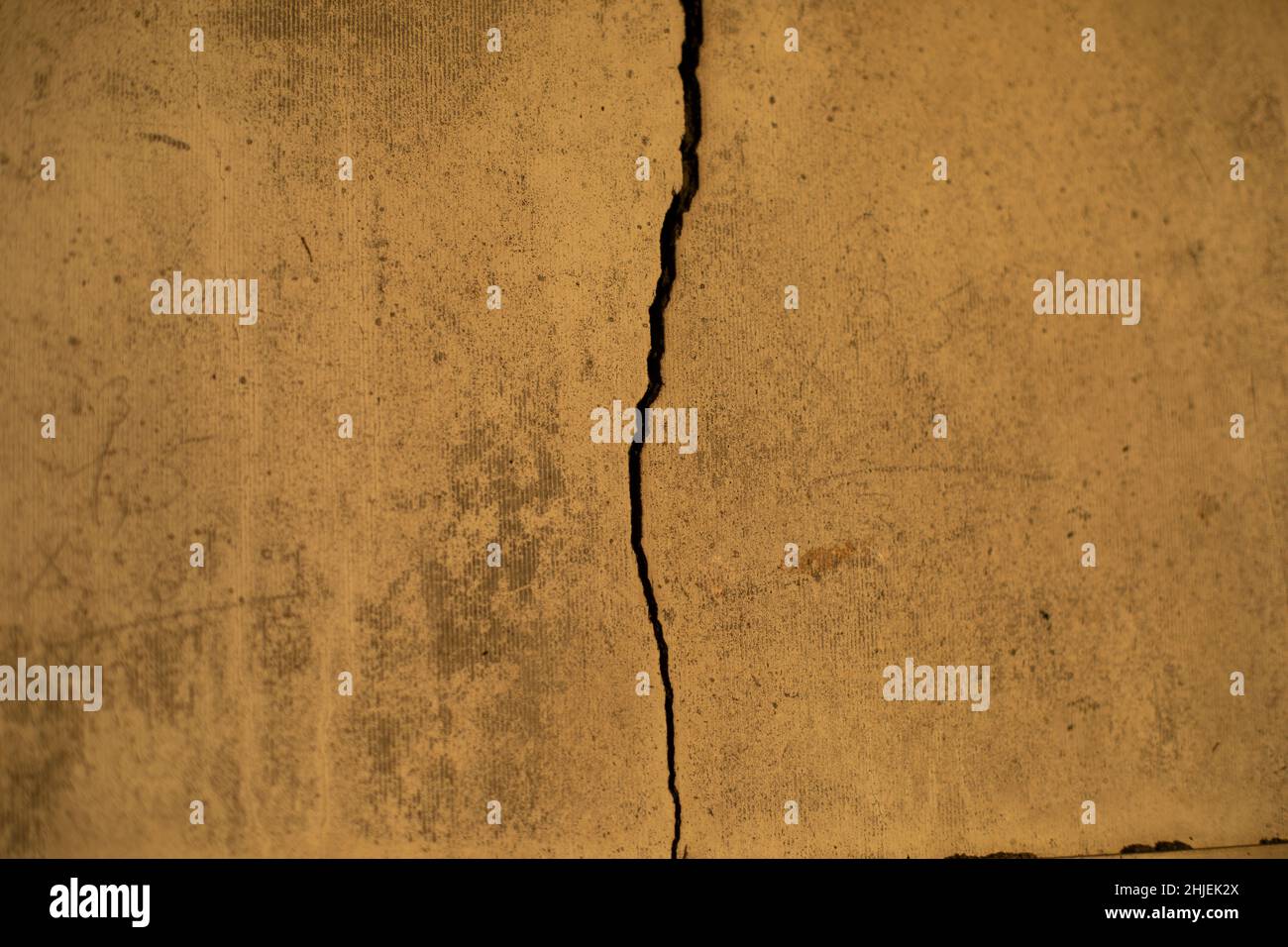 Crack in wall. Texture of concrete wall. Broken surface. Details of repair of apartment Stock