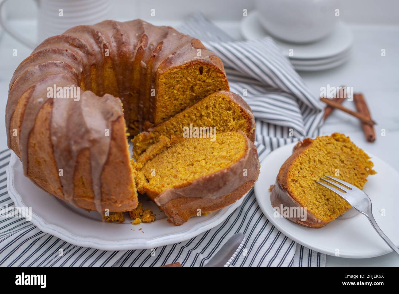 sweet saffron vanilla bundt cake on a table Stock Photo Alamy