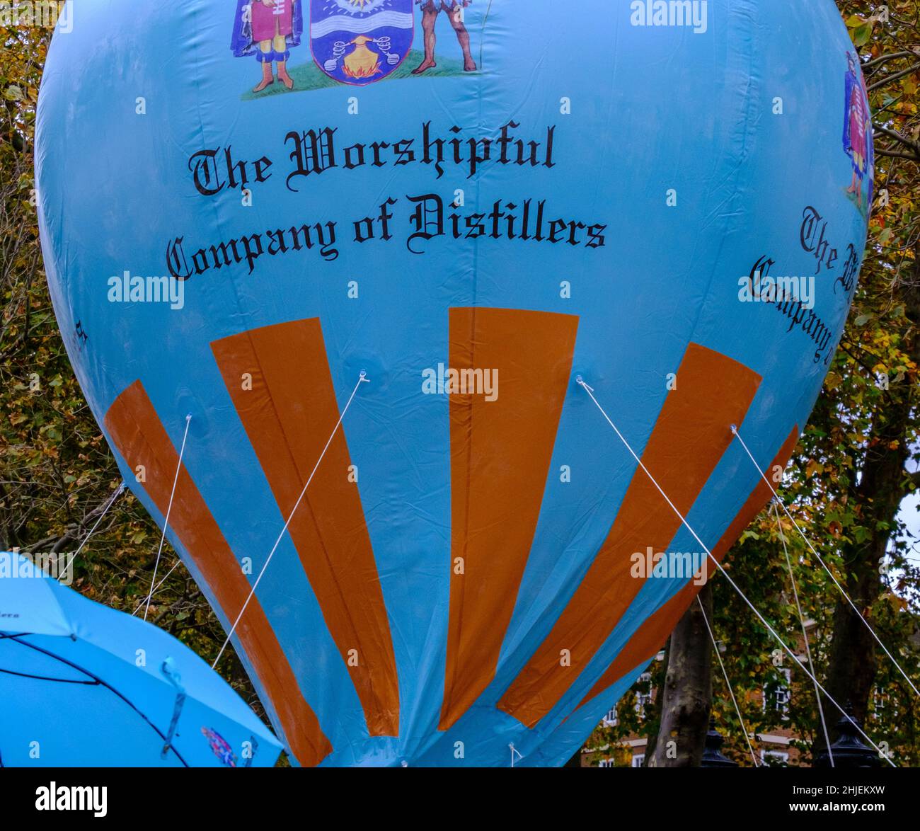Large blue hot air balloon with The Worshipful Company of Distillers on it at the Lord Mayor’s show 2021, Victoria Embankment, London, UK Stock Photo