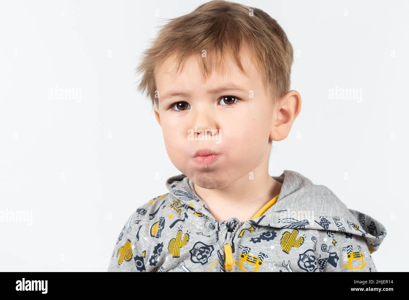 Cute caucasian boy shows myofunctional trainer. dental tariner is made to help equalize the growing teeth and correct bite, develop mouth breathing ha Stock Photo