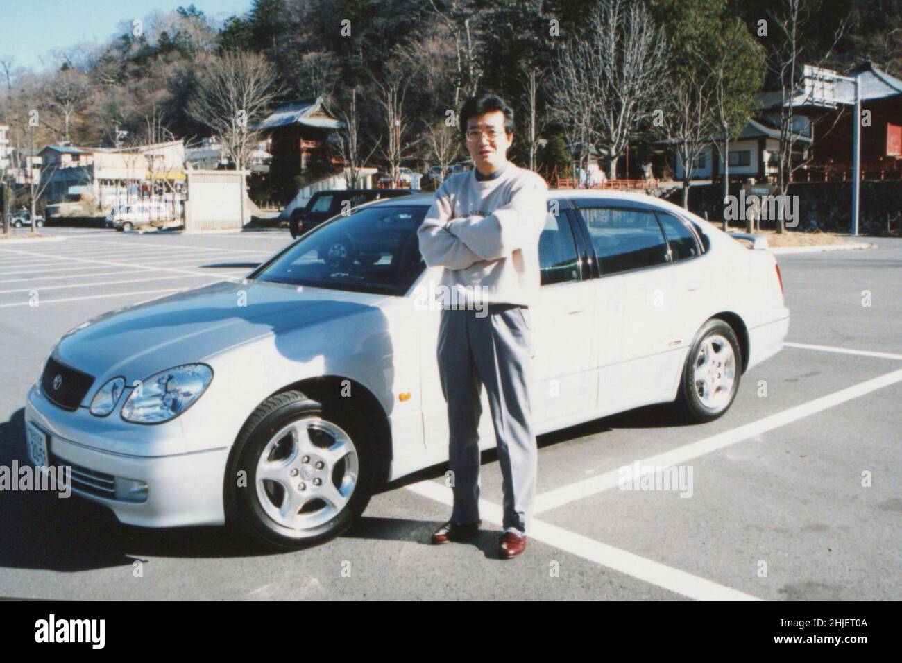 Man Portrait with Toyota Car Aristo. Scanned Copy of Archival Photo Stock Photo
