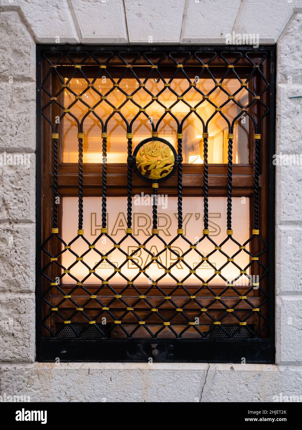 Venice, Italy - January 4 2022: Harry's Bar Sign in Venice, Italy Illuminated Window with Logo Stock Photo