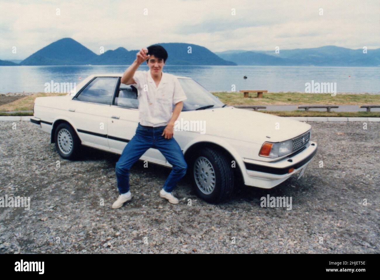Man Portrait with Toyota Car Chaser. Scanned Copy of Archival Photo Stock Photo