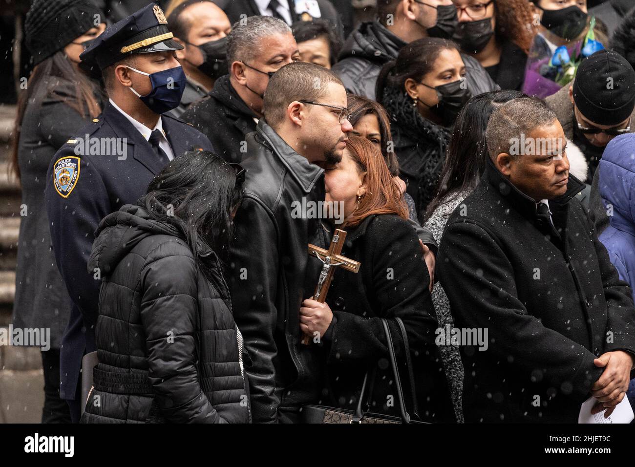 New York, United States. 28th Jan, 2022. Mother and brother of fallen officer embraced during St. Patrick's Cathedral for police officer Jason Rivera funeral. The 22-year-old Rivera was killed when he and fellow NYPD officer, Wilbert Mora, responded to a domestic incident in Harlem on January 21. Rivera was posthumously promoted Friday from officer to detective first-grade. (Photo by Lev Radin/Pacific Press) Credit: Pacific Press Media Production Corp./Alamy Live News Stock Photo