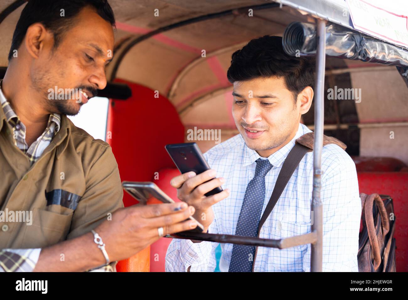 Qr Code On Rickshaw Auto rickshaw or cab passenger paying money by scanning qr code on ...