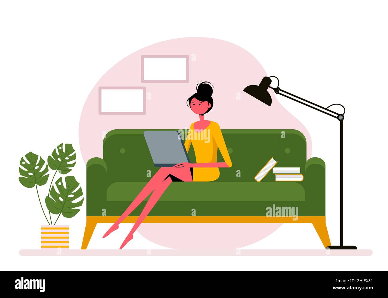 Woman with laptop sitting on the sofa with books. Freelance or studying ...