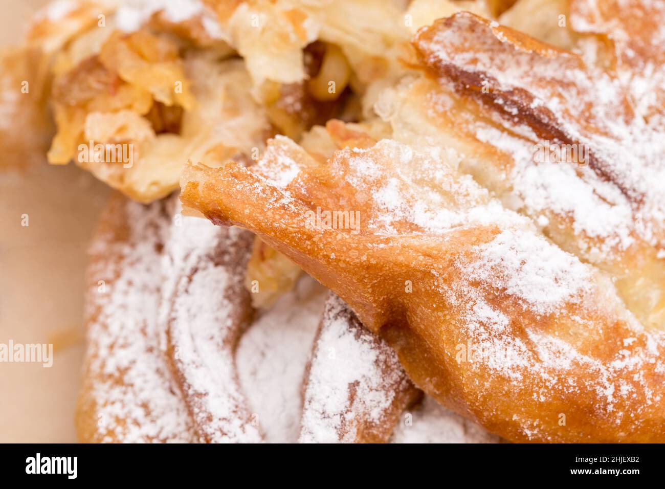 Heat apple puff cake in cardboard box. Macro. Can be used as a whole